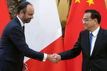 China's Premier Li Keqiang shakes hands with French Prime Minister Edouard Philippe at the Great Hall of the People in Beijing, China June 25, 2018. Fred Dufour/Pool via REUTERS