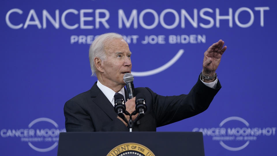 FILE - President Joe Biden speaks on the cancer moonshot initiative at the John F. Kennedy Library and Museum, Sept. 12, 2022, in Boston. Whenever the president travels, a special bullet-resistant lectern called the “blue goose,” or its smaller cousin “the falcon,” is in tow. Lately, Biden is rendering them all but obsolete as he increasingly reaches for a hand-held microphone instead. Those who know him best say the mic swap makes Biden a much more natural speaker. (AP Photo/Evan Vucci, File)