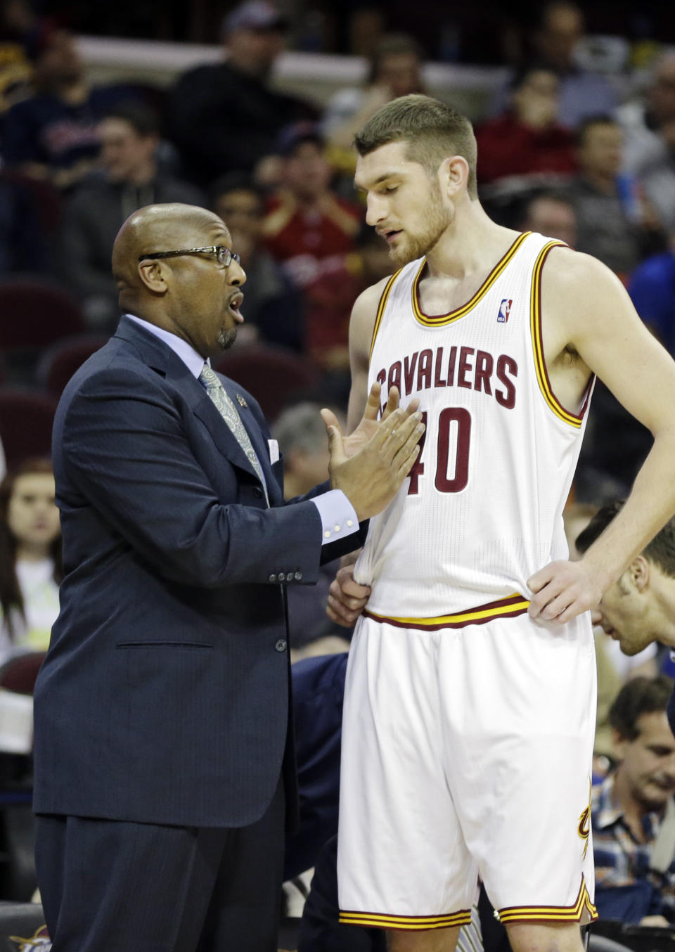 In this April 9, 2014 photo, Cleveland Cavaliers head coach Mike Brown talks to Tyler Zeller during an NBA basketball game against the Detroit Pistons in Cleveland. On Monday, May 12, 2014, the Cavaliers announced Brown has been released as head coach. (AP Photo)