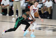 Boston Celtics' Marcus Smart, left, and Miami Heat's Duncan Robinson (55) compete for control of the ball during the second half of an NBA conference final playoff basketball game, Tuesday, Sept. 15, 2020, in Lake Buena Vista, Fla. (AP Photo/Mark J. Terrill)