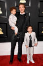 <p>Diplo looks dapper in black, but can we talk about how adorable his two sons are? </p>