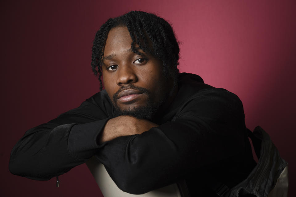 In this Nov. 30, 2018 photo, Shameik Moore, a cast member in "Spider-man: Into the Spider-Verse," poses for a portrait at the Four Seasons Hotel in Los Angeles. (Photo by Chris Pizzello/Invision/AP)