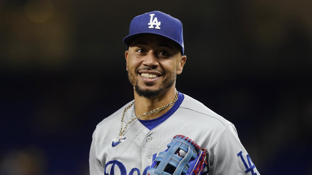 Los Angeles Dodgers right fielder Mookie Betts (50) runs on the field during a baseball game against the Miami Marlins, Friday, Aug. 26, 2022, in Miami. (AP Photo/Marta Lavandier)