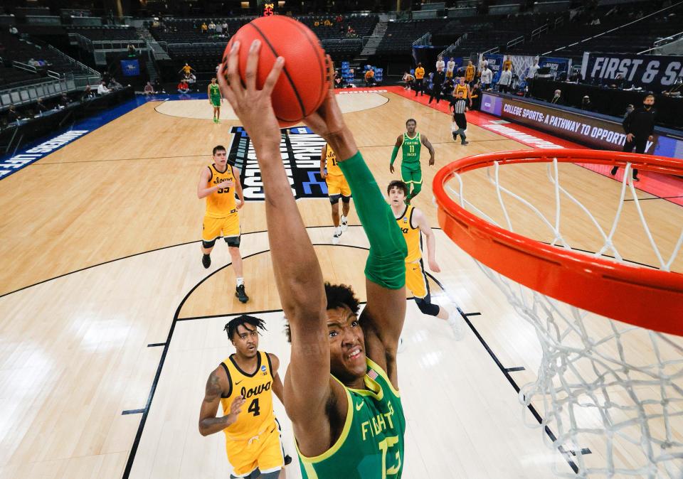Chandler Lawson of the Oregon Ducks dunks against the Iowa Hawkeyes in the second round game of the 2021 NCAA Men's Basketball Tournament at Bankers Life Fieldhouse.