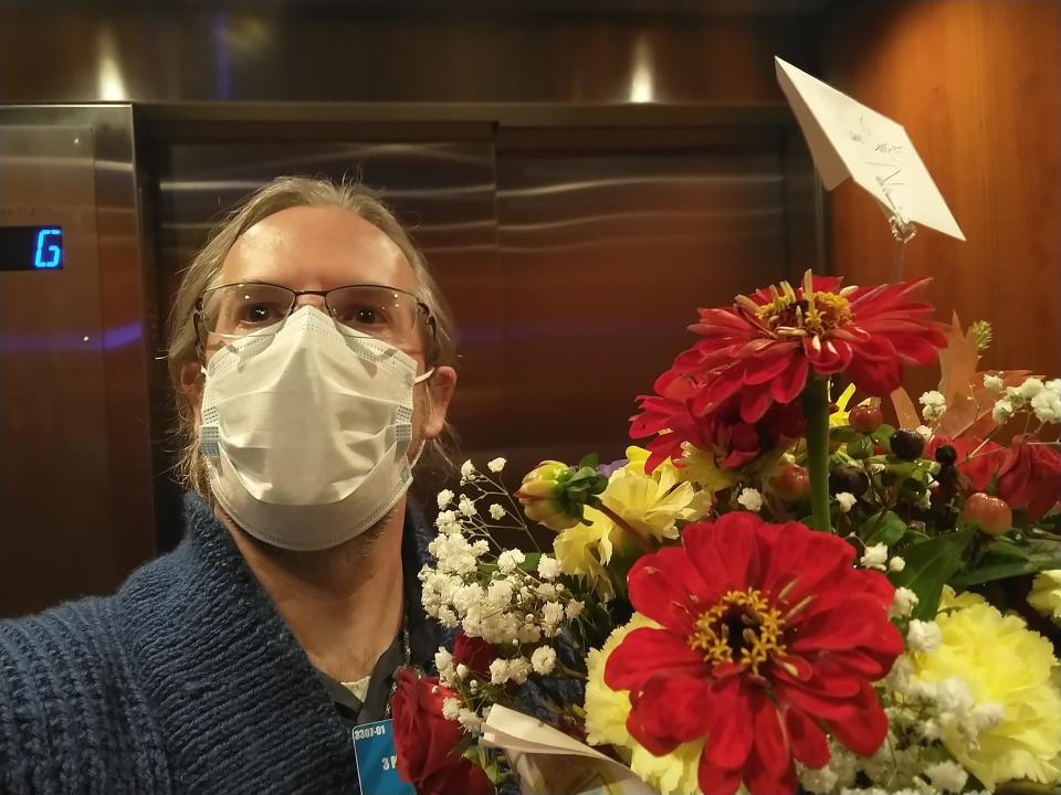 The Rev. Harold Wheat, pastor of Tabernacle United Methodist Church in Binghamton, brings flowers to a parishioner dying of COVID-19.