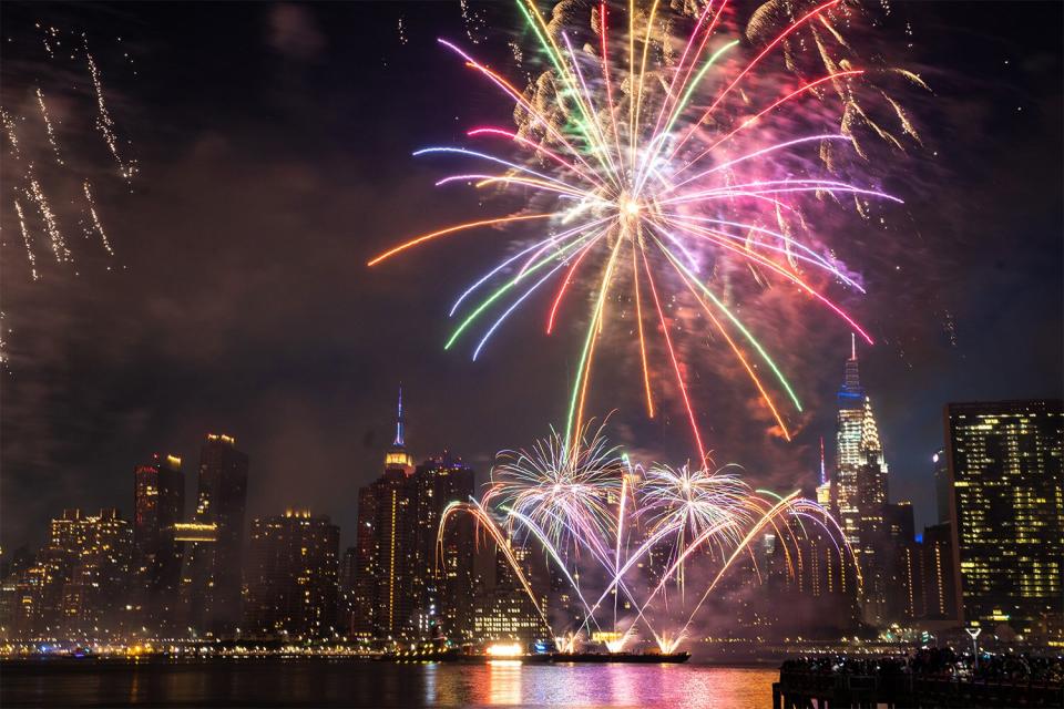 Fireworks during the Macy's Fourth of July celebration in New York, U.S., on Sunday, July 4, 2021. Macys annual fireworks display returned to its usual grand scale over the East River this July 4, the latest sign of normalcy returning to New York City, The New York Times reported. Photographer: Jeenah Moon/Bloomberg via Getty Images