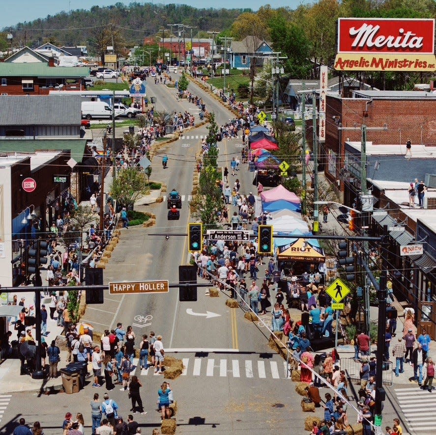 Crowds gather for Holleroo, the inaugural street festival that took place in the Happy Holler neighborhood April 13.