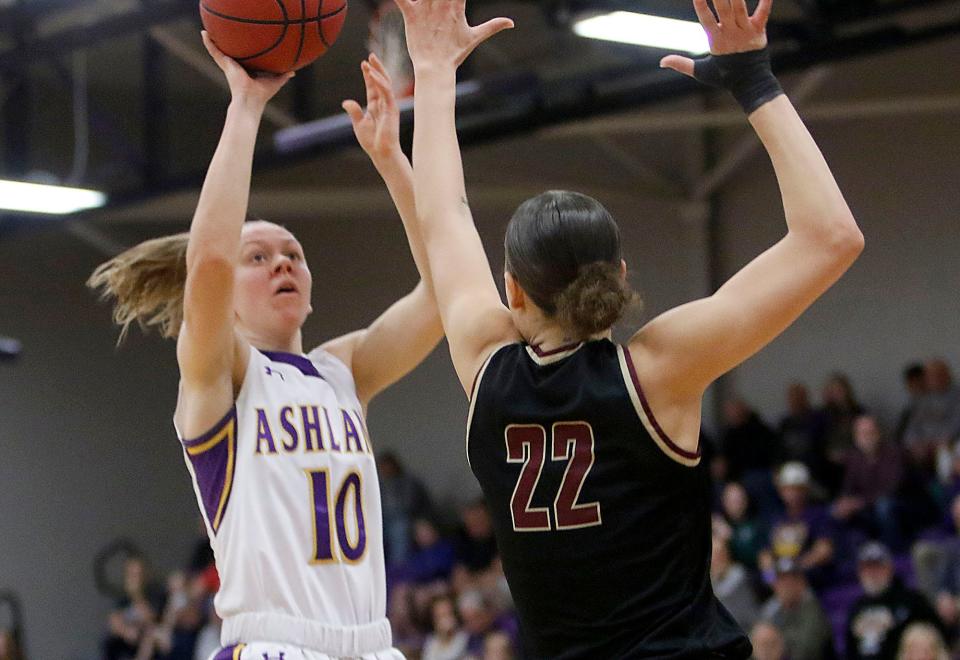 Ashland University's Hallie Heidemann (10) shoots as Walsh University's Mayci Sales (22) defends during first half college women's basketball action in the Great Midwest Athletic Conference tournament championship game on Saturday, March 5, 2022 at Kates Gymnasium. TOM E. PUSKAR/TIMES-GAZETTE.COM