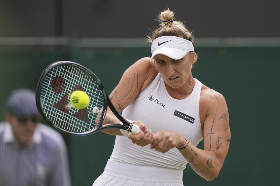 Czech Republic's Marketa Vondrousova plays a return to Czech Republic's Marie Bouzkova in the women's singles match on day seven of the Wimbledon tennis championships in London, Sunday, July 9, 2023. (AP Photo/Alberto Pezzali)