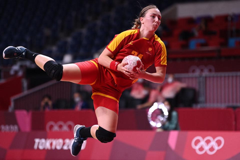 <p>Montenegro's pivot Tatjana Brnovic jumps to shoot during the women's preliminary round group A handball match between Montenegro and South Korea of the Tokyo 2020 Olympic Games at the Yoyogi National Stadium in Tokyo on July 31, 2021. (Photo by Daniel LEAL-OLIVAS / AFP)</p> 