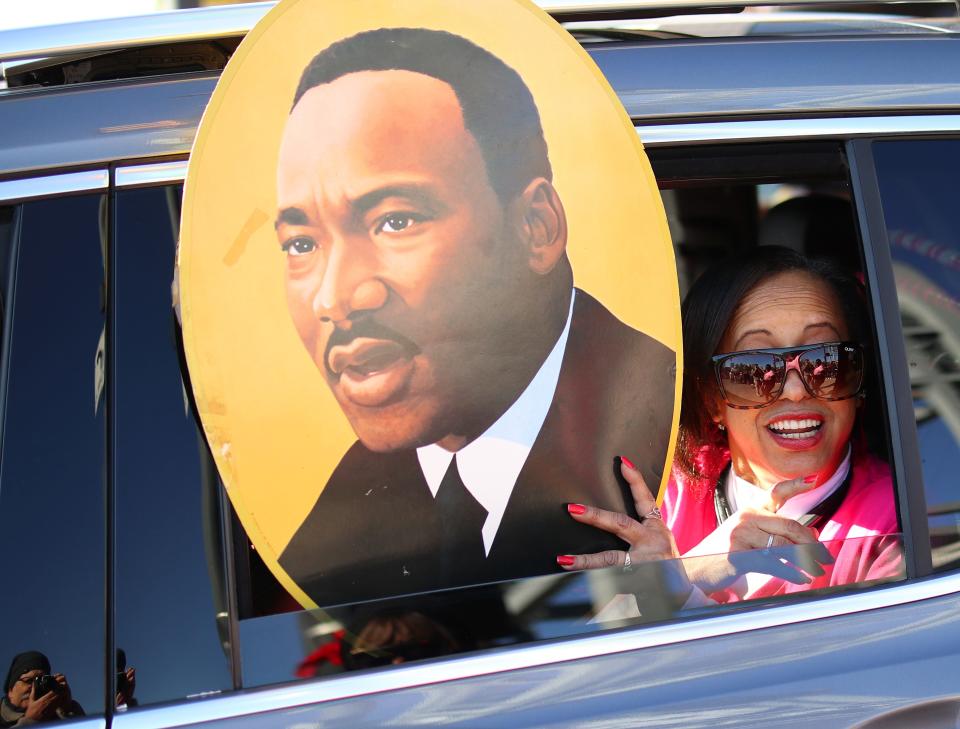 A woman in a car in the parade reacts to the crowd for the MLK Day Parade along Walker Ave. during celebrations of Dr. Martin Luther King, Jr. holiday, Monday, January 20, 2019. [Photo by Doug Hoke/The Oklahoman]