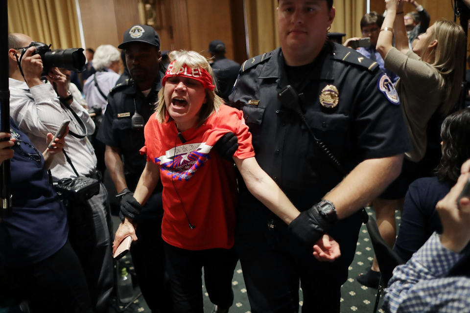 <p>U.S. Capitol Police arrest protesters from handicap advocacy organizations as they shout and interrupt a Senate Finance Committee hearing about the proposed Graham-Cassidy Healthcare Bill in the Dirksen Senate Office Building on Capitol Hill September 25, 2017 in Washington, DC. Demonstrators disrupted the hearing to protest the legislation, the next in a series of Republican proposals to replace the Affordable Care Act, also called Obamacare. (Photo: Chip Somodevilla/Getty Images) </p>