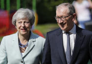 Britain's Prime Minister Theresa May and her husband Philip arrive at a polling station to vote in the European Elections in Sonning, England, Thursday, May 23, 2019.(AP Photo/Frank Augstein)