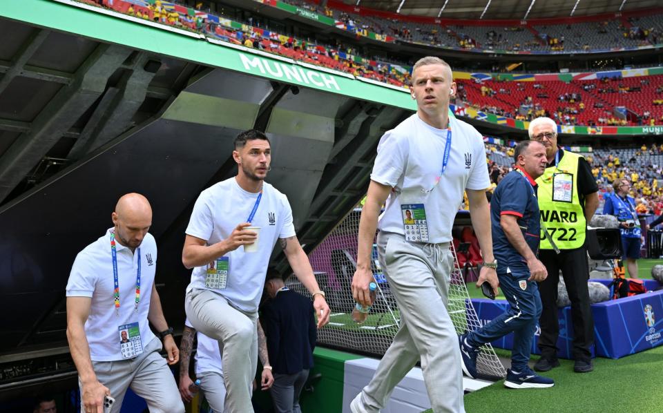 Oleksandr Zinchenko leads out Yaremchuk ahead of their Euro 2024 opener against Romania