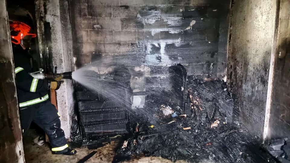 The scene of a fire in the master bedroom of a fourth-level unit at Block 141 Yishun Ring Road on the morning of 29 June, 2021. (PHOTO: SCDF)
