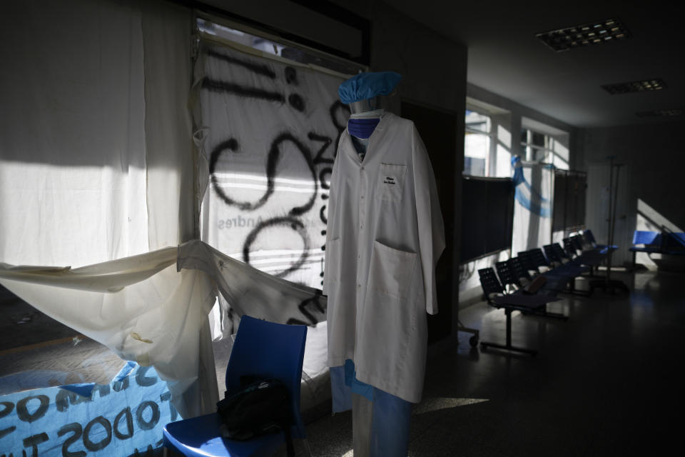 A waiting room sits empty inside San Andres Clinic which has been occupied by its former workers since it closed at the start of the year following the death of the hospital's director and owner in Caseros, Argentina, Friday, April 30, 2021. While the pandemic has swelled the need for hospital beds, many private clinics say they're struggling to survive, citing the pandemic having pushed away many non-COVID patients and losing money on coronavirus sufferers because the government insurance program doesn't pay enough to meet costs. (AP Photo/Natacha Pisarenko)