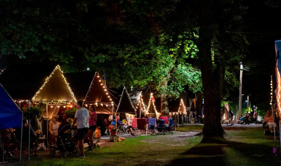 Families and friends visit at their tents at the Centre County Grange Fair on Thursday, Aug. 26, 2021.