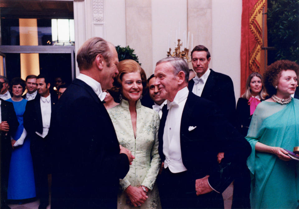 President Gerald R. Ford and First Lady Betty Ford speaking with Fred Astaire at the State Dinner held in honor of Shah Mohammad Reza of Iran. - Credit: White House Historical Association