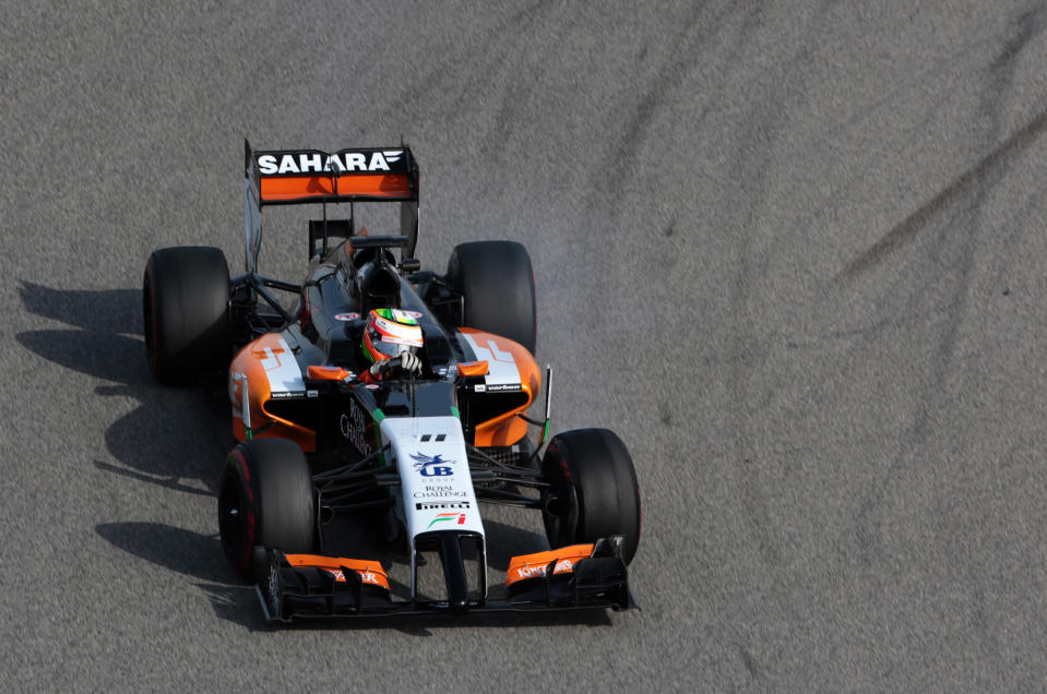 Formula One driver Sergio Perez of Force India speeds down the track during pre-season testing at the Bahrain International Circuit in Sakhir, Bahrain, on Thursday, Feb. 27, 2014. (AP Photo/Hasan Jamali)