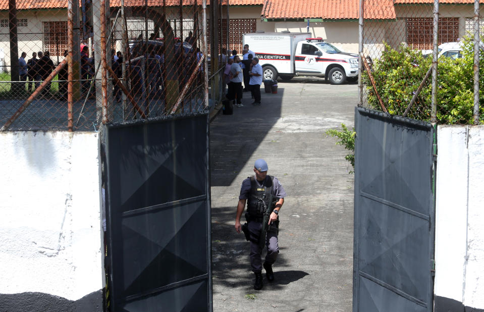 <em>A policeman is seen in the entrance of the Raul Brasil school after a shooting in Suzano, Sao Paulo state, Brazil (Reuters)</em>