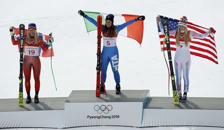 Alpine Skiing - Pyeongchang 2018 Winter Olympics - Women's Downhill - Jeongseon Alpine Centre - Pyeongchang, South Korea - February 21, 2018 - Ragnhild Mowinckel of Norway, Sofia Goggia of Italy, and Lindsey Vonn of the U.S. react during the victory ceremony. REUTERS/Mike Segar