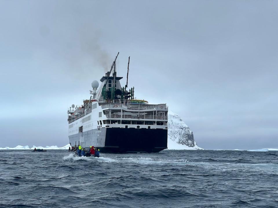 The Ocean Endeavour with smoke blowing from the top.