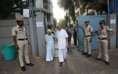 A couple leaves after casting their vote at a polling station in Mumbai, India April 29, 2019. REUTERS/Francis Mascarenhas