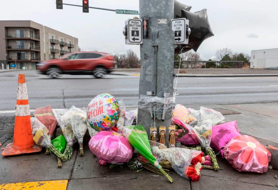 Family and friends erected a memorial for the three crash victims at the intersection of George Washington Way and Jadwin Avenue in February 2022.
