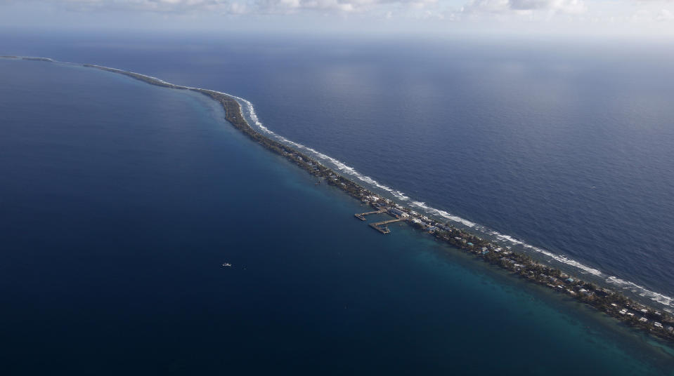 FILE - Funafuti, the main island nation state Tuvalu, is seen from a Royal New Zealand airforce C130 aircraft as it approaches at Funafuti, Tuvalu, South Pacific, on Oct. 13, 2011. Voting started Friday, Jan. 26, 2024, in the tiny Pacific island nation of Tuvalu, in a national election that could reverberate from China to Australia. (AP Photo/Alastair Grant, File)