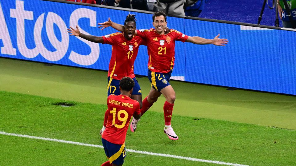 Spain's Mikel Oyarzabal (right) celebrates scoring the winning goal against England. - Angelika Warmuth/Reuters