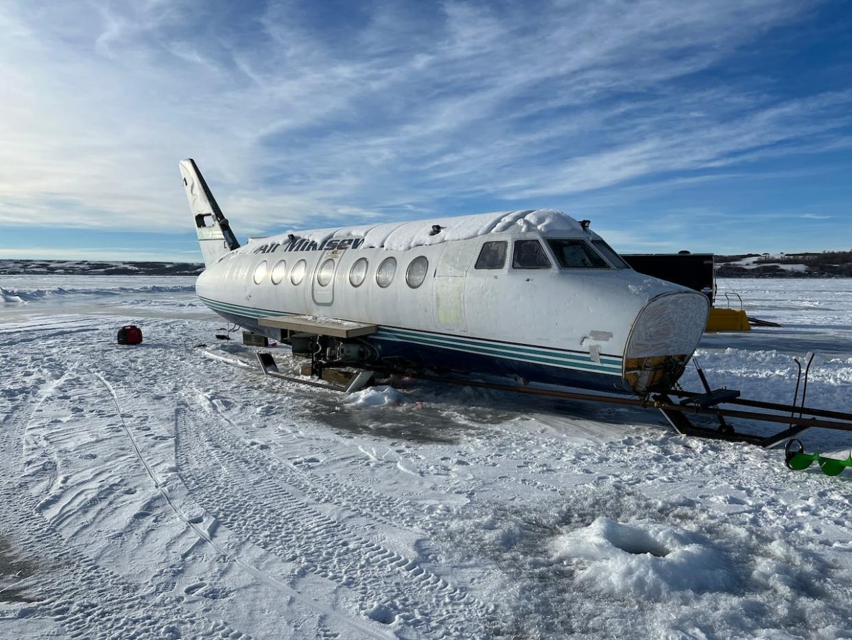 This British Aerospace Jetstream aircraft, previously owned by Fort McMurray, Alta.-based Air Mikisew, is one of the more unique ice shacks in the province. (Ethan Williams/CBC - image credit)