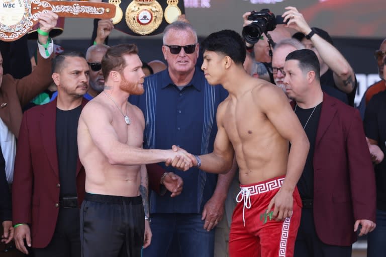Saul Alvarez and challenger Jaime Munguia shake hands at the weigh-in for their all-Mexican super middleweight world title bout in Las Vegas (Christian Petersen)
