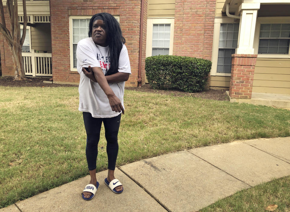 Tracey Haley, the mother of a letter carrier who shot a supervisor and a manager before killing himself in a Tennessee postal facility, speaks with reporters outside of her son's apartment on Thursday, Oct. 14, 2021, in Cordova, Tenn. Haley told The Associated Press Thursday that her 28-year-old son Johntra Haley was a non-violent person who had been bullied at work. (AP Photo/Adrian Sainz)