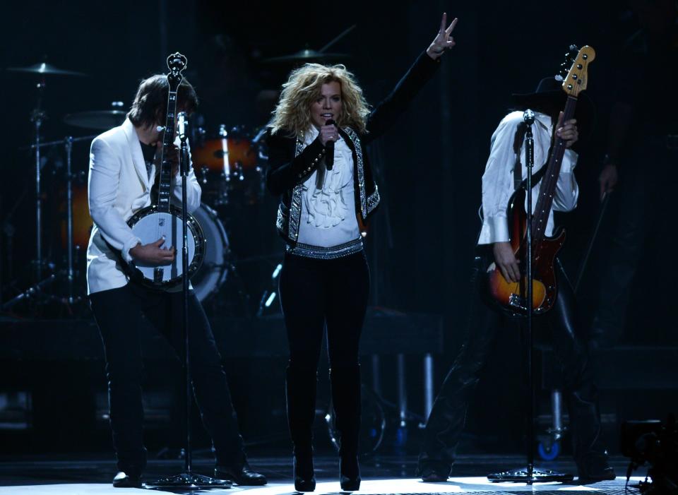 NASHVILLE, TN - NOVEMBER 01: (L-R) Neil Perry, Kimberly Perry, and Reid Perry of The Band Perry perform during the 46th annual CMA Awards at the Bridgestone Arena on November 1, 2012 in Nashville, Tennessee. (Photo by Jason Kempin/Getty Images)