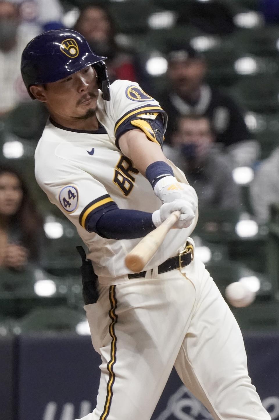 Milwaukee Brewers' Keston Hiura hits an RBI single during the sixth inning of a baseball game against the Chicago Cubs Monday, April 12, 2021, in Milwaukee. (AP Photo/Morry Gash)