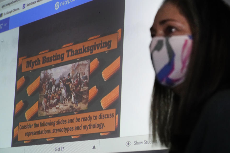 Susannah Remillard teaches her sixth-grade students at Cape Cod Lighthouse Charter School, Thursday, Nov. 19, 2020, in East Harwich, Mass. In a growing number of U.S. schools, students are now learning a more complex Thanksgiving story that involves conflict, injustice and a new focus on the native people who lived in New England for centuries before European settlers arrived. (AP Photo/Elise Amendola)