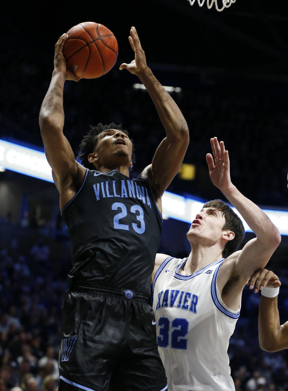 Villanova forward Jermaine Samuels (23) shoots over Xavier forward Zach Freemantle (32) during the second half of an NCAA college basketball game, Saturday, Feb. 22, 2020, in Cincinnati. (AP Photo/Gary Landers)