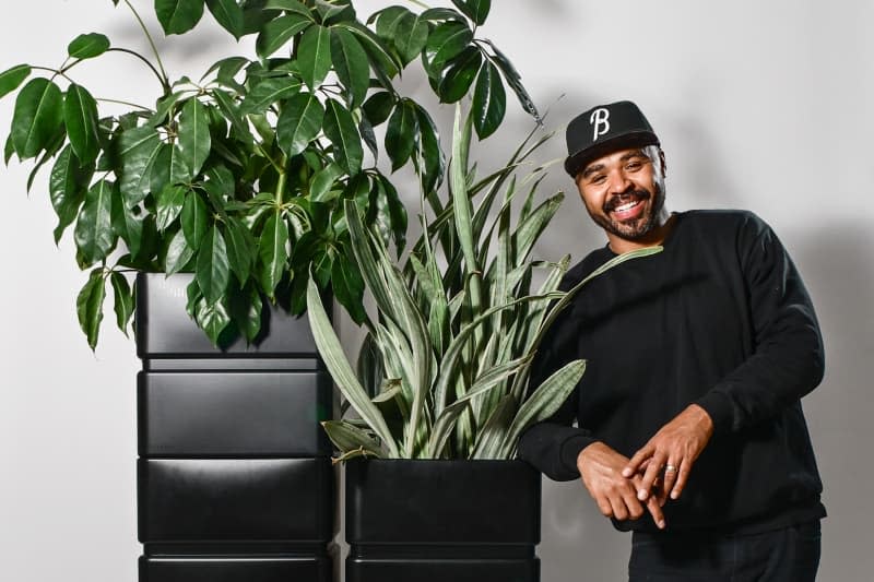 Hilton Carter for Target PR photo, collaborator with stacked planters.