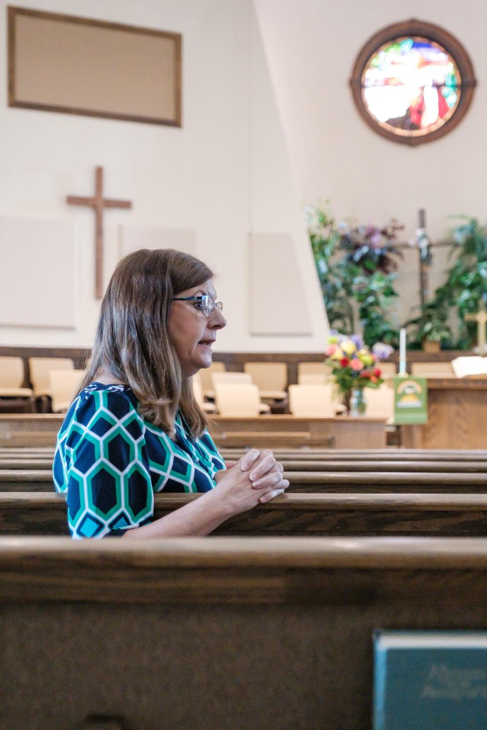 Pastor Shelly Nordine of Dover Faith Global Methodist Church reflects upon disaffiliation from the United Methodist Church while sitting in a pew at the Broadway Global Methodist Church in New Philadelphia.