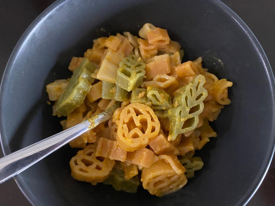 navy blue bowl of cooked fall-shaped pasta from aldi