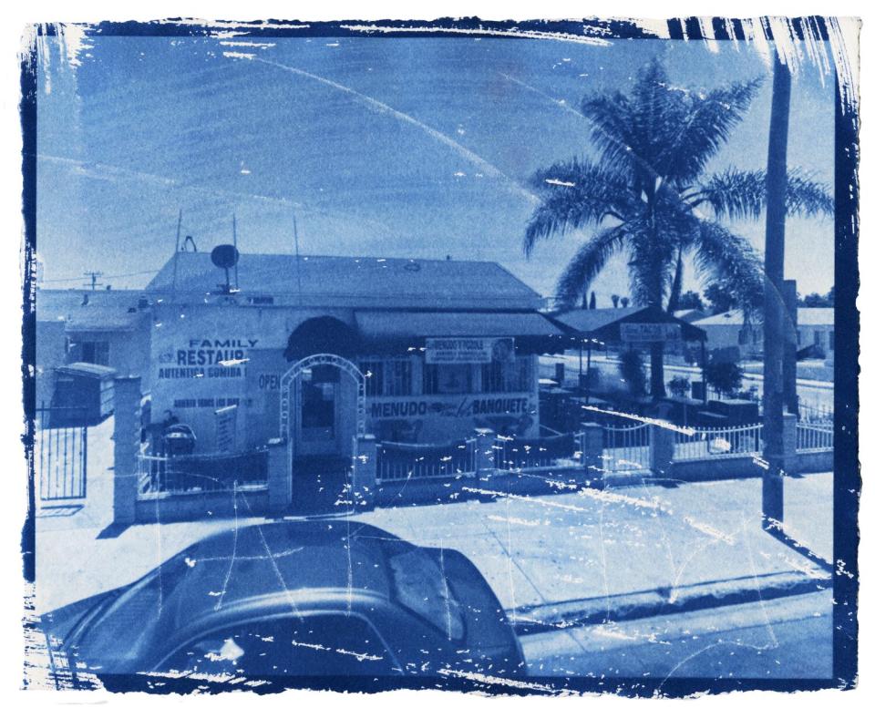 A cyanotype of a family home restaurant on a neighborhood corner in southeast la