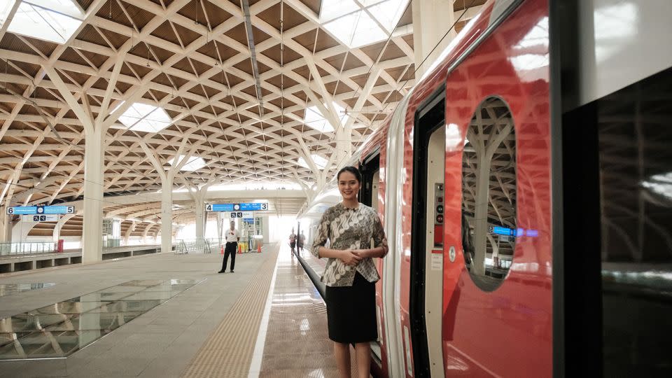 A staff member waits for passengers to board the Jakarta-Bandung high-speed train during a week-long public trial phase at the Halim station in Jakarta on September 17, 2023. - Yasuyoshi Chiba/AFP/Getty Images