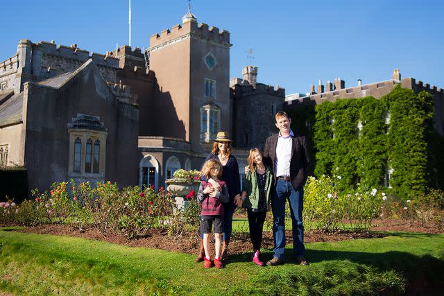 <p>Julian Broad/Getty</p> AJ Langer, Charles Courtenay and their children Joscelyn and Jack photographed at home at Powderham Castle in Devon, UK on October 27, 2017