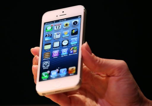 Made of glass and aluminum, the new iPhone 5 features a new design to nestle in one's palm to naturally align with thumbs and works on the faster mobile Internet networks known as LTE