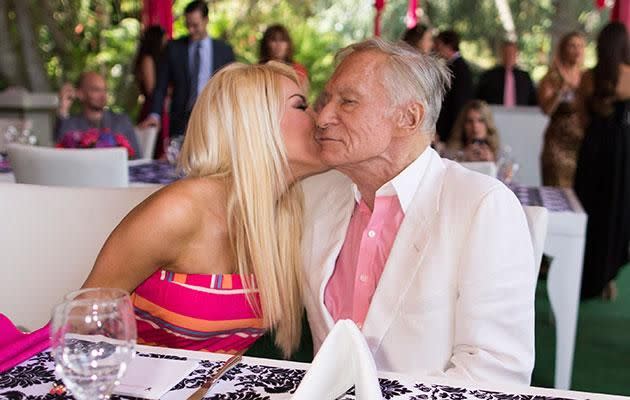 Hef and Crystal share a kiss. Source: Getty