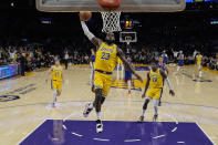 Los Angeles Lakers forward LeBron James (23) dunks during the first half of Game 3 of an NBA basketball first-round playoff series against the Denver Nuggets in Los Angeles, Thursday, April 25, 2024. (AP Photo/Ashley Landis)