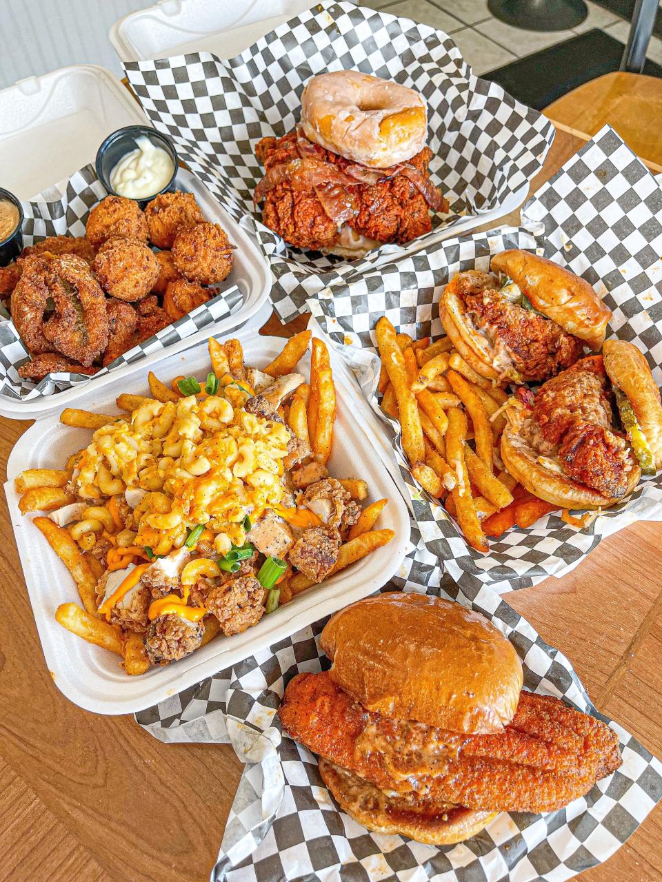 Fat Daddy's hot chicken, catfish and chicken cheese fries with mac and cheese on top.