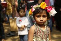 <p>A girl poses for a photograph at the National Book Fair at Bangla Academy in Dhaka, Bangladesh, Feb. 17, 2017. (Photo: Abir Abdullah/EPA) </p>