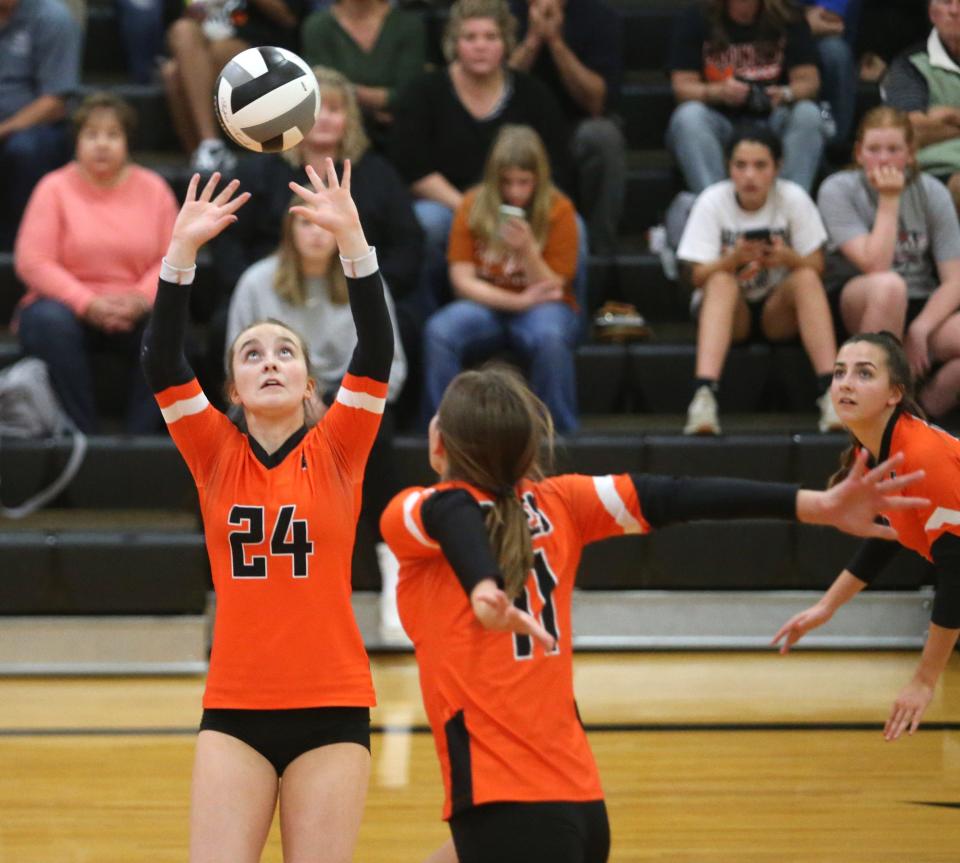 Janelle Swisher, 24, of Marlington sets the ball as Chelsea Evanich, 11, moves in on the play during their game against Hoover at Marlington on Thursday, Oct. 6, 2022.