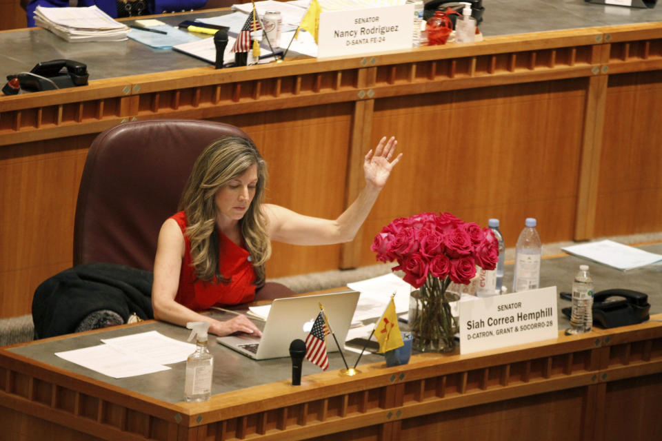 Democratic state Sen. Siah Correa Hemphill of Silver City, N.M., raises her hand to vote no against a bill on Tuesday, March 14, 2023, in Santa Fe, N.M. New Mexico's Legislature had until noon on Saturday to send bills to the governor. (AP Photo/Morgan Lee)
